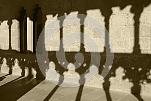 Romanesque arcade with columns and shadows in Olite. Navarra, Sp