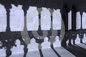 Romanesque arcade with columns and shadows in Olite. Navarra, Sp