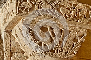 Romanesque capitel in San Pedro de la Nave church. Spain photo