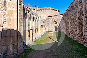 Romanesque monastery courtyard with stone arches