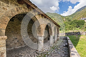 Romanesque porch and church of Santa Eulalia de Erill la vall, Catalonia, Spain.