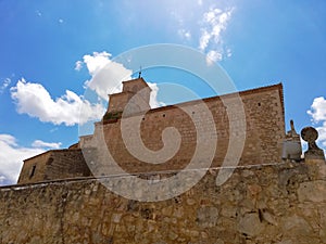 Romanesque style stone church against blue sky