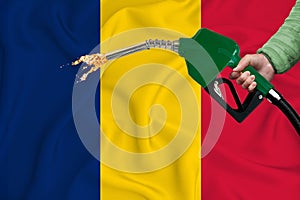 ROMANIA flag Close-up shot on waving background texture with Fuel pump nozzle in hand. The concept of design solutions. 3d