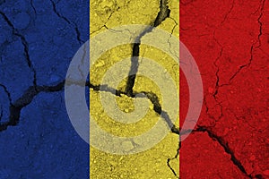 Romania flag on the cracked earth