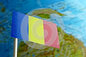 Romania flag with a globe map as a background