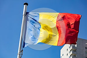 Romania flag waving against clear blue sky