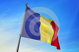 Romania flag waving on the blue sky 3D illustration