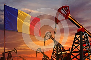 Romania oil industry concept. Industrial illustration - Romania flag and oil wells with the red and blue sunset or sunrise sky
