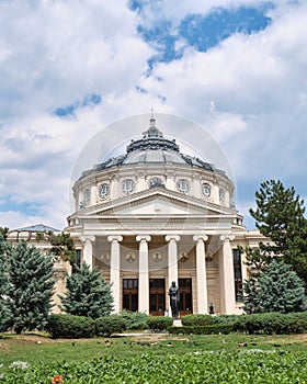 Romanian Athenaeum (Ateneul Roman), a landmark in Bucharest, Romania, with clouds above this concert hall building