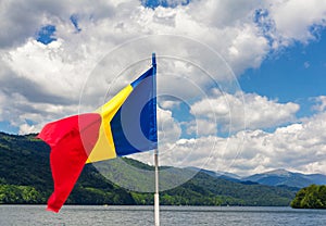 Romanian flag on the Vidraru lake