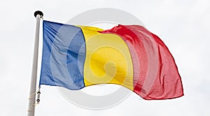 Romanian flag waving against cloudy sky background