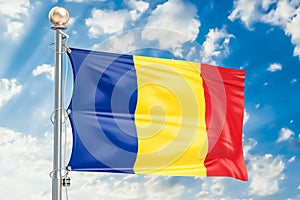 Romanian flag waving in blue cloudy sky, 3D rendering