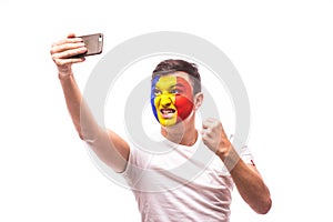 Romanian football fan take selfie photo with phone on white background