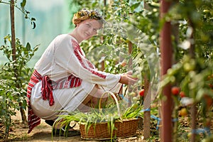 Romanian girl in costume in the hothouse