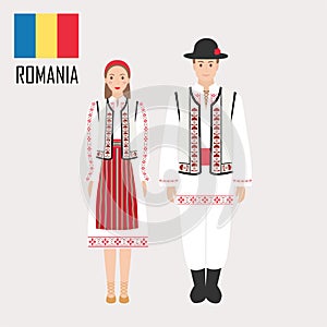 Romanian man and woman in traditional costumes photo