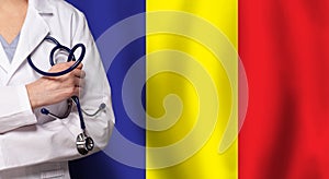 Romanian medicine and healthcare concept. Doctor close up against flag of Romania background