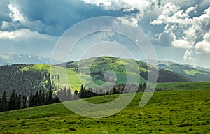 Romanian mountains landscape with dark clouds. Cindrel mountains