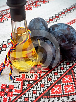 romanian plum brandy known as tuica or tzuica in a glass known as tzoi or toi