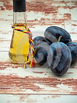 romanian plum brandy known as tuica or tzuica in a glass known as tzoi or toi