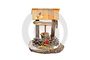 A romanian souvenir with a traditional wooden fountain isolated on a white background