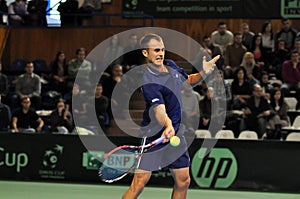 Romanian tennis player Marius Copil in action
