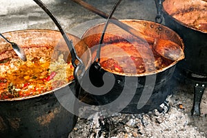 Romanian traditional food prepared at the cauldron on the open fire