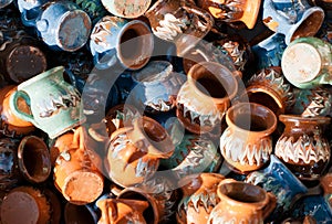 Romanian traditional pottery handcrafted mugs at a souvenir shop. Romanian traditional handcrafted pottery