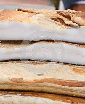 Romanian traditional salty pork belly specialty named slanina, on counter