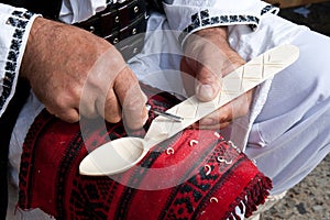 Romanian traditional wooden spoon making photo