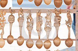 Romanian traditional wooden spoons. Set of handcrafted wooden spoons in a Romanian market.
