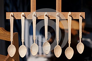 Romanian traditional wooden spoons. Set of handcrafted wooden spoons in a Romanian market.