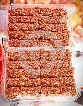 Romanian uncooked meat rolls called mititei, mici