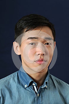 Romanic young Asian man looking at camera