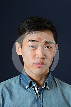 Romanic young Asian man looking at camera