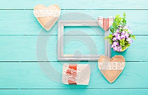 Romantic accessories on blue wooden background with copy space.Top view