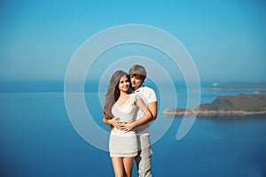 Romantic affectionate young couple in love on vacation over sea