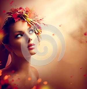 Romantic autumn girl with colorful leaves