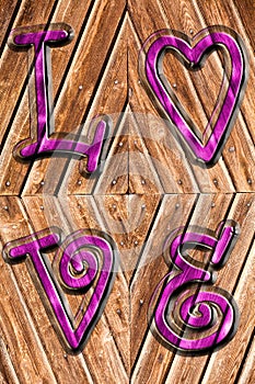 Romantic background on antique wood and purple word love impressed above