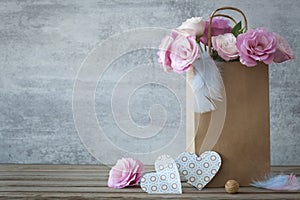 Romantic background with roses and handmade hearts