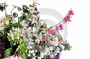 Romantic bouquet with dicentra, allium, lily of the valley, birdman photo