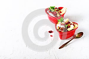 Romantic breakfast with chia, granola, yogurt and berries on old white concrete background. Health and diet concept.