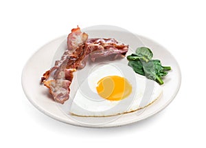 Romantic breakfast with fried bacon and heart shaped egg isolated on white. Valentine`s day celebration