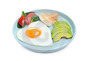 Romantic breakfast with fried heart shaped egg, avocado and toast isolated on white. Valentine`s day celebration