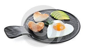 Romantic breakfast with fried heart shaped egg, avocado and toasts isolated on white. Valentine`s day celebration