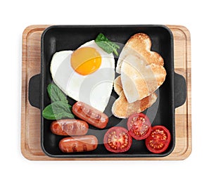 Romantic breakfast with fried sausages, heart shaped egg and toasts isolated on white, top view. Valentine`s day celebration