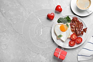 Romantic breakfast on grey table, flat lay with space for text. Valentine`s day celebration