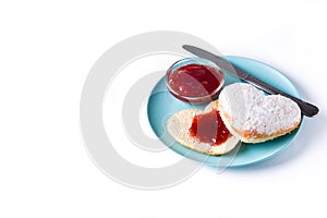 Romantic breakfast with heart-shaped bun and berry jam isolated