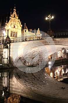 Romantic bridge and its reflection at night in Ghent, Belgium
