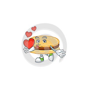 A romantic cartoon character of brown alfajor with a heart