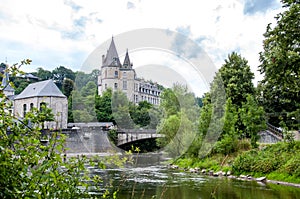 Romantic castle along a beautiful river in the forest of the Belgian Ardennes